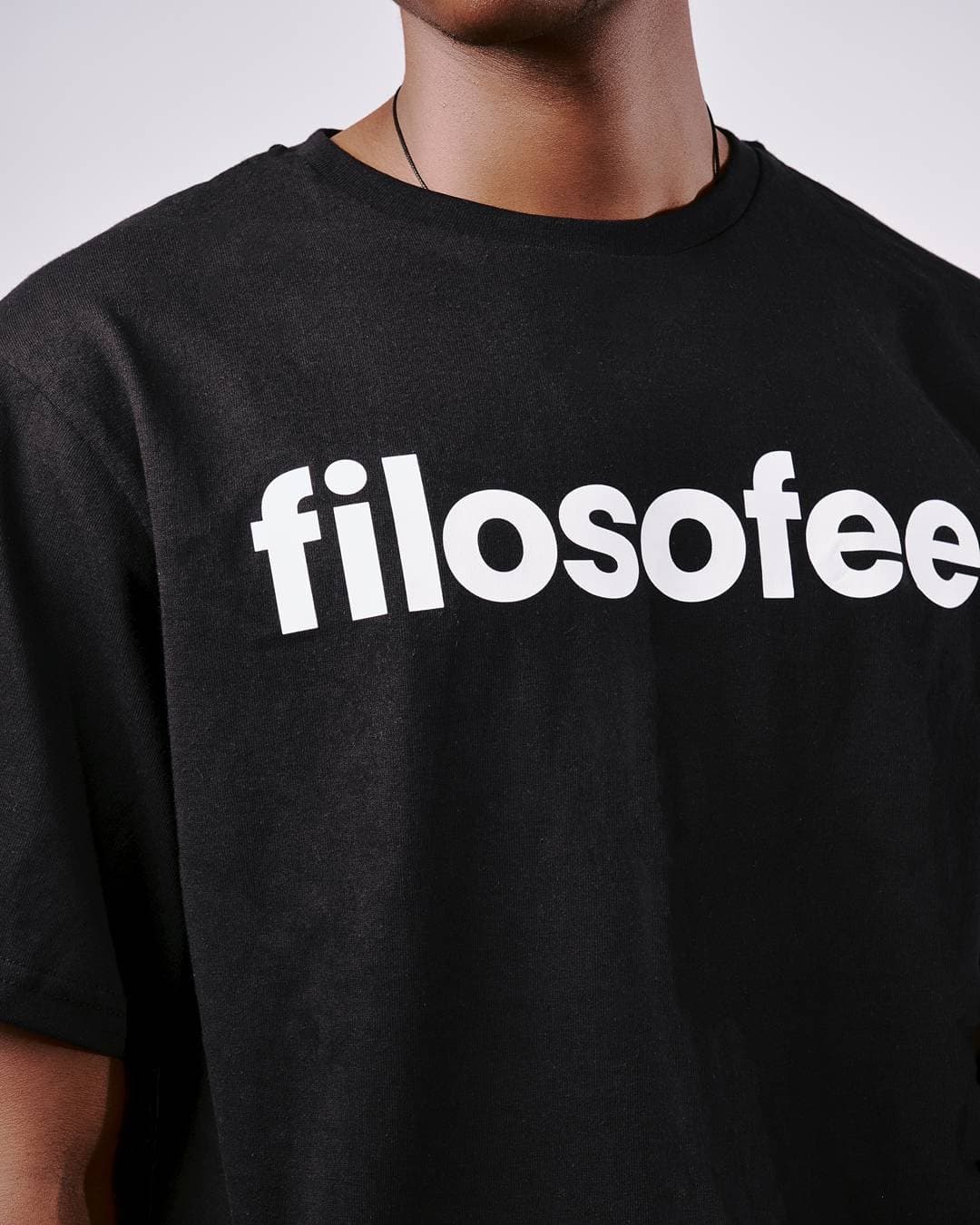 Studio shot of the Filosofee wordmark tee